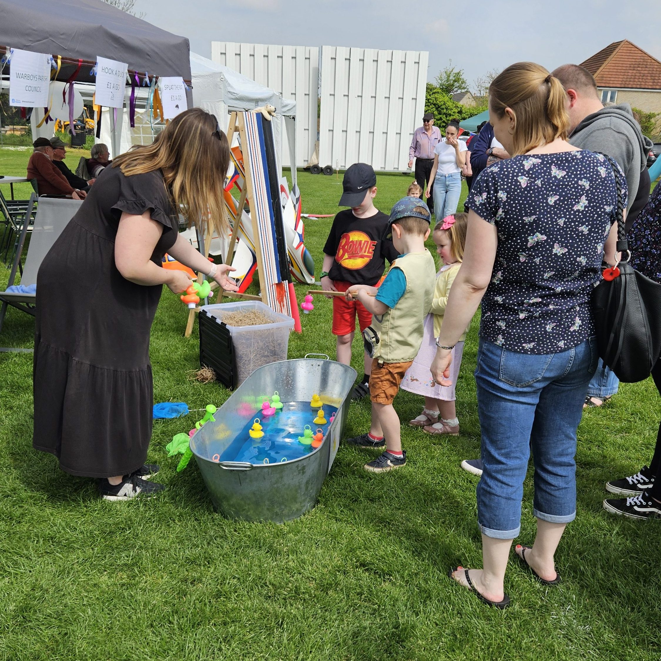 Warboys Residents enjoying Hook a duck at the May Day Fete